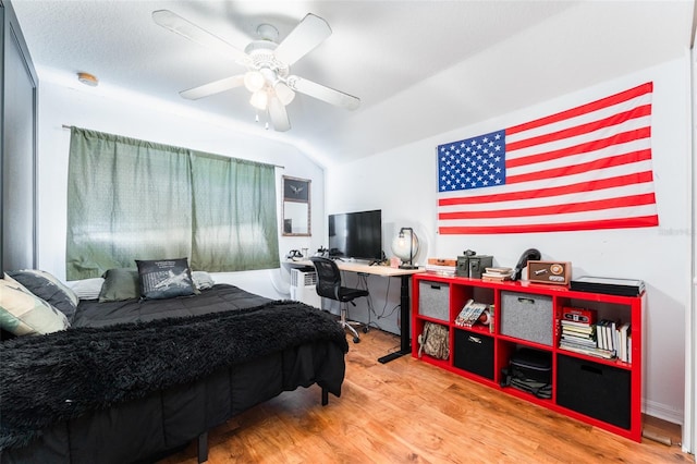 8050 Diablo Ct, Trinity, FL 34655 - bedroom featuring wood finished floors, lofted ceiling, and ceiling fan
