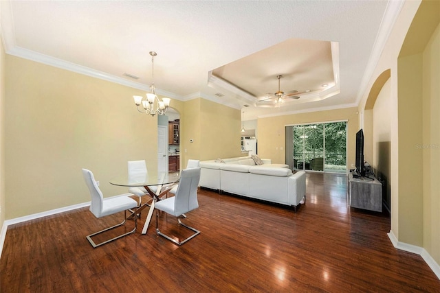 11220 Paradise Pointe Way, New Port Richey, FL 34654 - dining room featuring arched walkways, wood finished floors, a ceiling fan, ornamental molding, and a chandelier