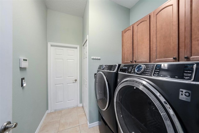 11220 Paradise Pointe Way, New Port Richey, FL 34654 - washroom with washing machine and clothes dryer, cabinet space, and light tile patterned floors
