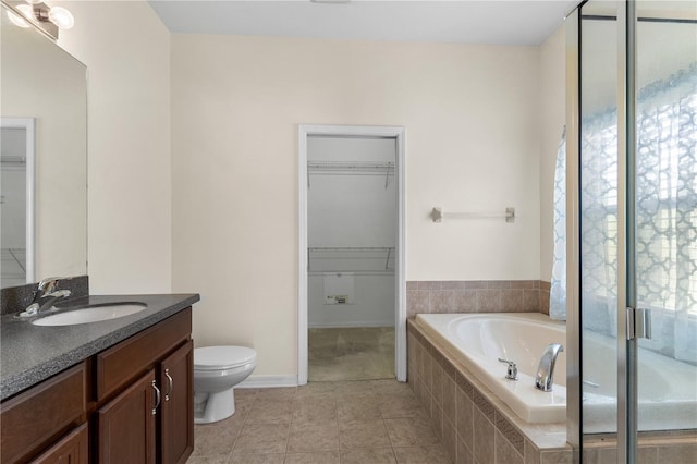 12631 Chenwood Ave, Hudson, FL 34669 - full bath with vanity, a spacious closet, a bath, tile patterned floors, and a shower stall