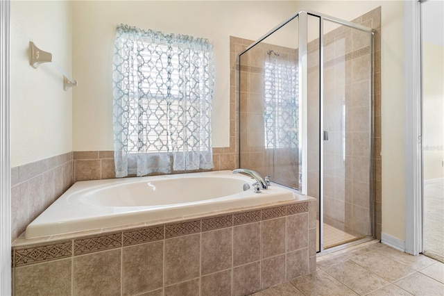 12631 Chenwood Ave, Hudson, FL 34669 - bathroom featuring a garden tub, a stall shower, and tile patterned floors