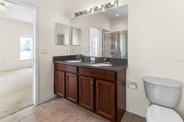 12631 Chenwood Ave, Hudson, FL 34669 - bathroom with double vanity, a shower stall, and tile patterned floors