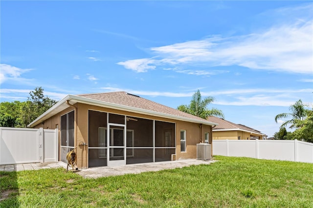 12631 Chenwood Ave, Hudson, FL 34669 - rear view of property featuring a sunroom and stucco siding