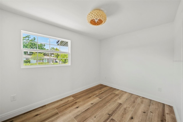 4704 W Fairview Hts, Tampa, FL 33616 - unfurnished room featuring light wood-style floors and baseboards