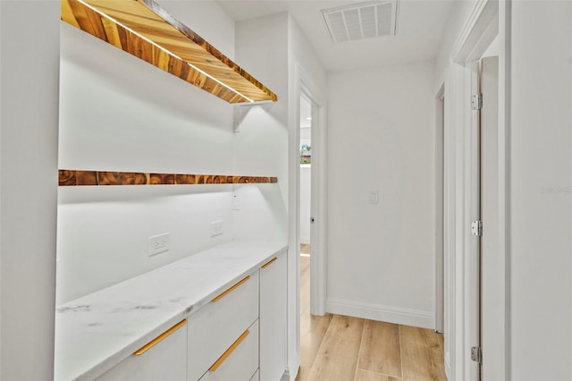 4704 W Fairview Hts, Tampa, FL 33616 - hallway featuring light wood-style flooring and baseboards