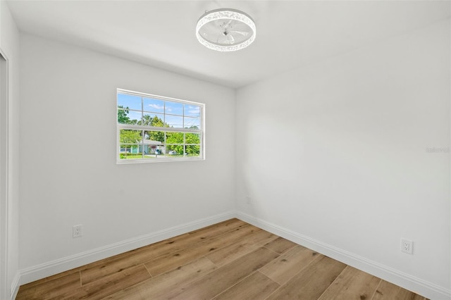 4704 W Fairview Hts, Tampa, FL 33616 - empty room featuring wood finished floors and baseboards