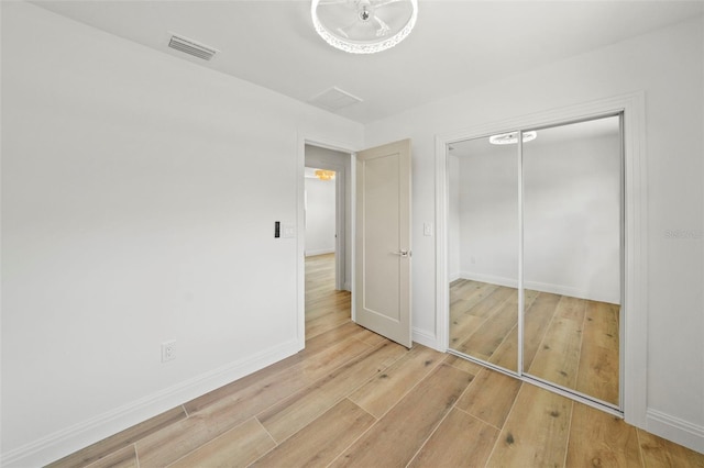 4704 W Fairview Hts, Tampa, FL 33616 - unfurnished bedroom with wood finished floors and a closet