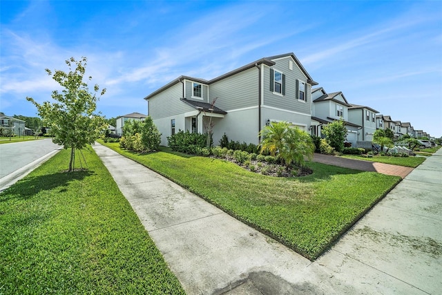 4608 Emprise Way, Land O Lakes, FL 34638 - view of side of home featuring a residential view, a lawn, stucco siding, and driveway