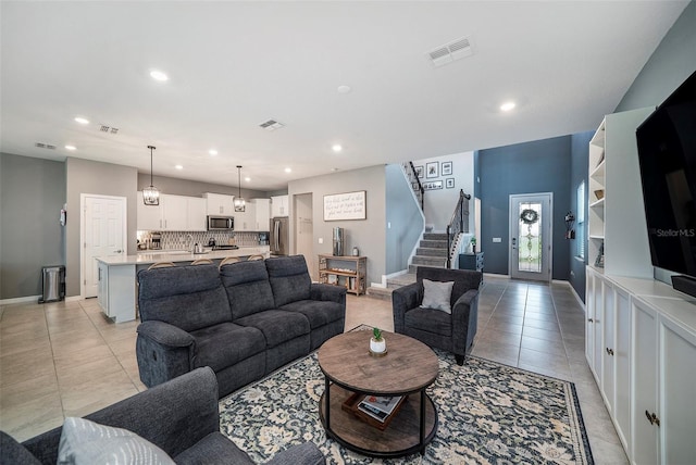 4608 Emprise Way, Land O Lakes, FL 34638 - living area featuring stairs, light tile patterned floors, and recessed lighting