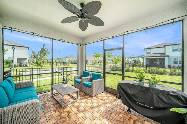 4608 Emprise Way, Land O Lakes, FL 34638 - sunroom with a residential view, a ceiling fan, and healthy amount of natural light
