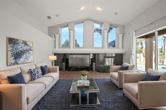 10101 Paddock Oaks Dr, Riverview, FL 33569 - living room featuring high vaulted ceiling and wood finished floors