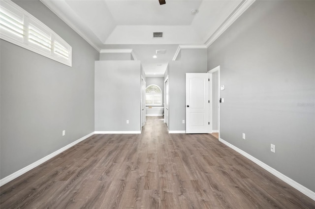 10101 Paddock Oaks Dr, Riverview, FL 33569 - unfurnished room featuring a tray ceiling, a ceiling fan, wood finished floors, and crown molding
