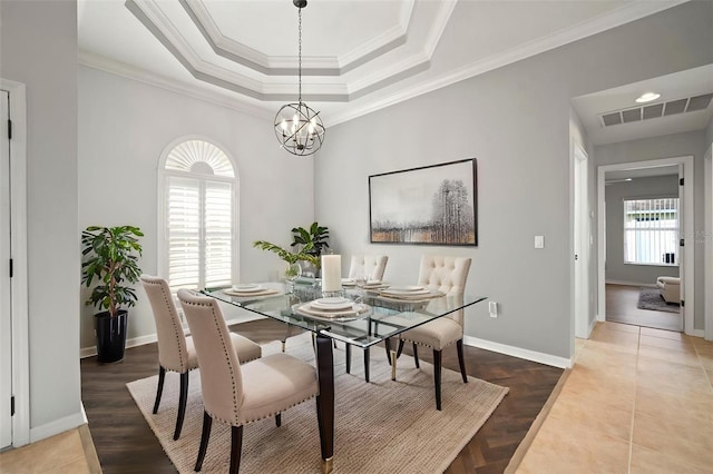 10101 Paddock Oaks Dr, Riverview, FL 33569 - dining space featuring a chandelier, crown molding, and a tray ceiling