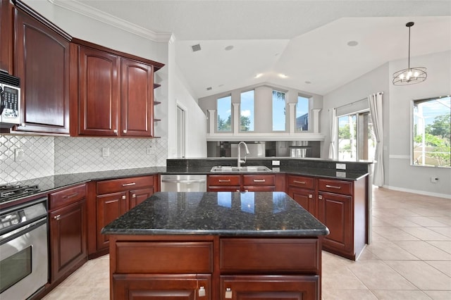 10101 Paddock Oaks Dr, Riverview, FL 33569 - kitchen with appliances with stainless steel finishes, backsplash, a peninsula, lofted ceiling, and reddish brown cabinets