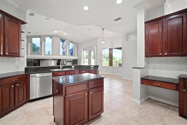 10101 Paddock Oaks Dr, Riverview, FL 33569 - kitchen with stainless steel dishwasher, a peninsula, vaulted ceiling, crown molding, and light tile patterned floors