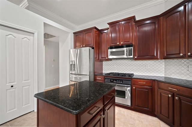 10101 Paddock Oaks Dr, Riverview, FL 33569 - kitchen with appliances with stainless steel finishes, crown molding, tasteful backsplash, dark stone countertops, and light tile patterned floors