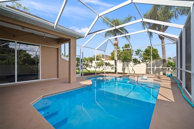 10101 Paddock Oaks Dr, Riverview, FL 33569 - view of pool featuring a patio area, glass enclosure, and a pool with connected hot tub