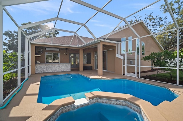 10101 Paddock Oaks Dr, Riverview, FL 33569 - view of swimming pool with french doors, a patio, ceiling fan, glass enclosure, and a pool with connected hot tub