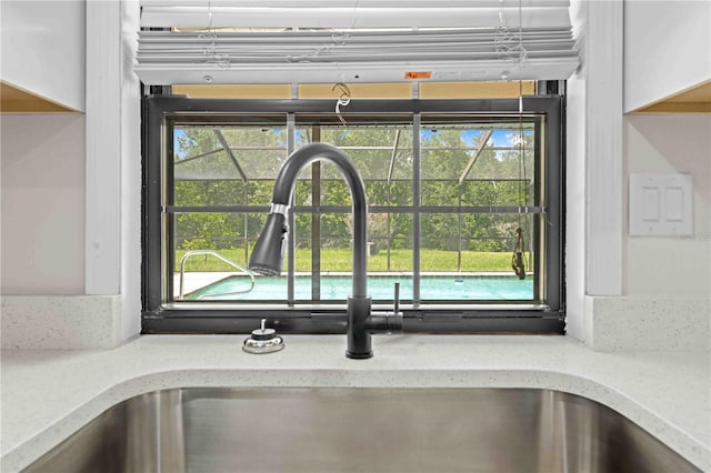 2141 Coachman Rd, Spring Hill, FL 34608 - kitchen view of a sink and light stone counters
