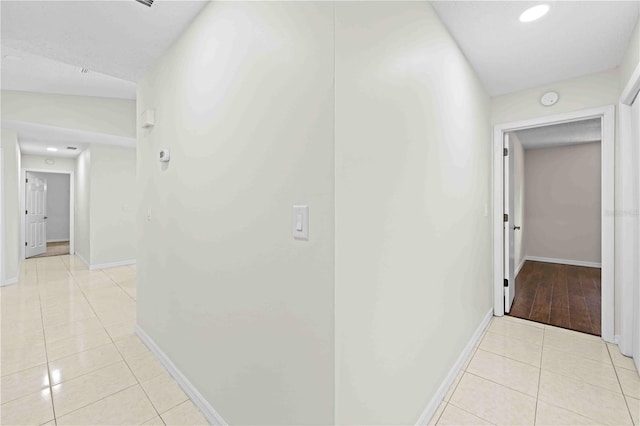 2141 Coachman Rd, Spring Hill, FL 34608 - hall featuring light tile patterned flooring and recessed lighting