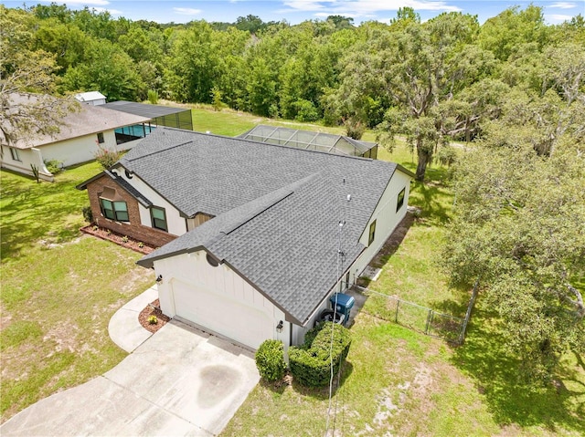 2141 Coachman Rd, Spring Hill, FL 34608 - aerial view of property and surrounding area featuring a forest
