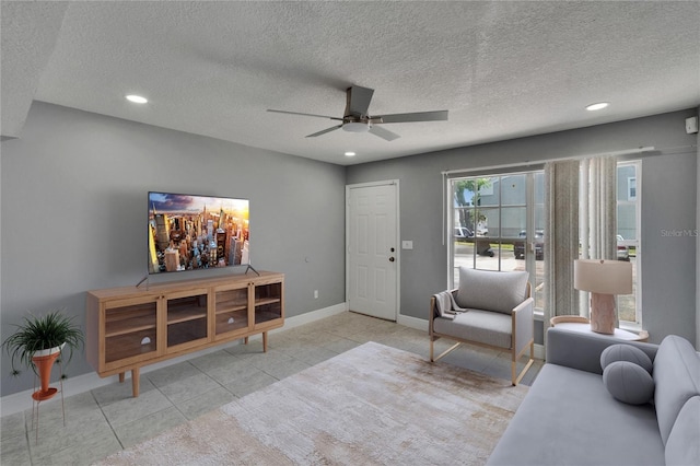 6601 121st Ave Unit I, Largo, FL 33773 - living area featuring a ceiling fan, recessed lighting, a textured ceiling, and tile patterned flooring