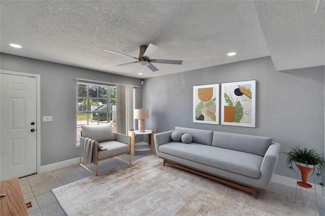 6601 121st Ave Unit I, Largo, FL 33773 - living area featuring a ceiling fan, a textured ceiling, light tile patterned flooring, and recessed lighting