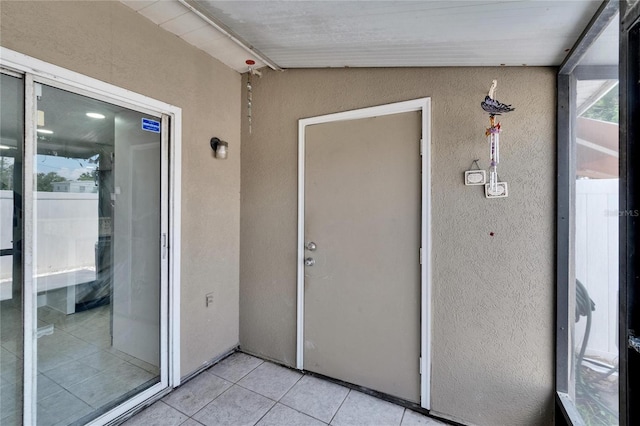 6601 121st Ave Unit I, Largo, FL 33773 - unfurnished sunroom featuring lofted ceiling