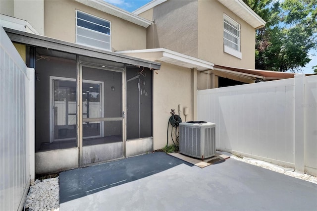 6601 121st Ave Unit I, Largo, FL 33773 - view of patio featuring a sunroom