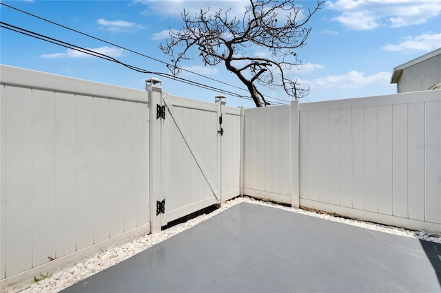6601 121st Ave Unit I, Largo, FL 33773 - view of patio / terrace featuring a gate