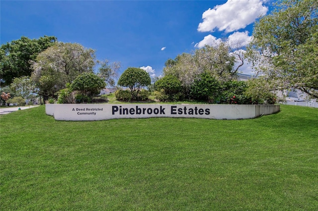 6601 121st Ave Unit I, Largo, FL 33773 - community / neighborhood sign featuring a yard