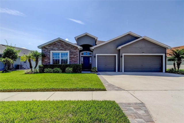 6648 Castle Green Pl, Zephyrhills, FL 33541 - single story home featuring an attached garage, stucco siding, a front yard, and concrete driveway