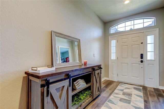 6648 Castle Green Pl, Zephyrhills, FL 33541 - foyer entrance featuring a textured wall and wood finished floors