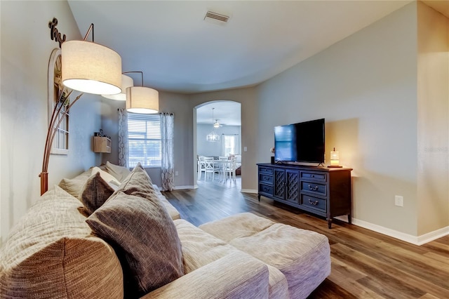 6648 Castle Green Pl, Zephyrhills, FL 33541 - living room featuring wood finished floors and arched walkways