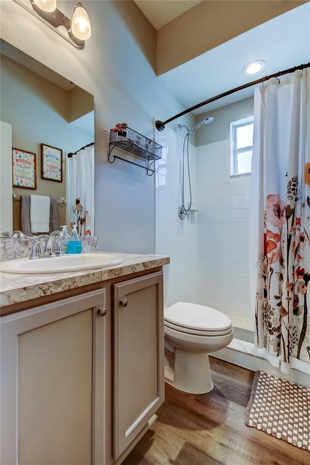 6648 Castle Green Pl, Zephyrhills, FL 33541 - full bath featuring vanity, wood finished floors, and a tile shower