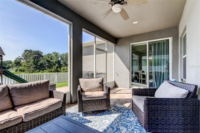 6648 Castle Green Pl, Zephyrhills, FL 33541 - sunroom / solarium featuring a ceiling fan and an outdoor living space