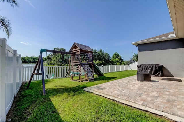 6648 Castle Green Pl, Zephyrhills, FL 33541 - fenced backyard with a playground and a patio