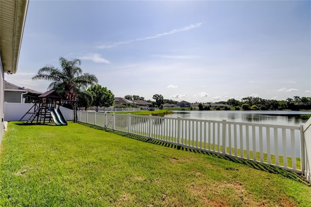 6648 Castle Green Pl, Zephyrhills, FL 33541 - fenced backyard featuring a playground and a water view