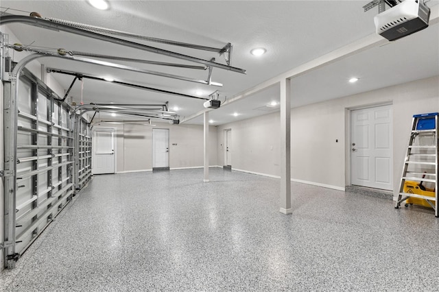 3663 Berger Rd, Lutz, FL 33548 - garage featuring a garage door opener and recessed lighting