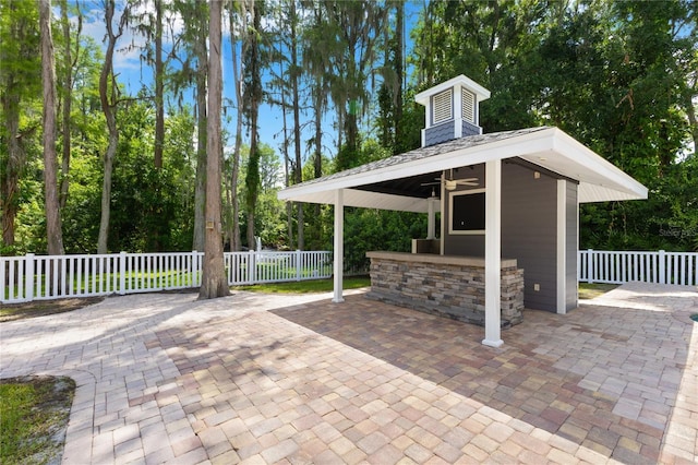 3663 Berger Rd, Lutz, FL 33548 - view of patio featuring ceiling fan and a gazebo