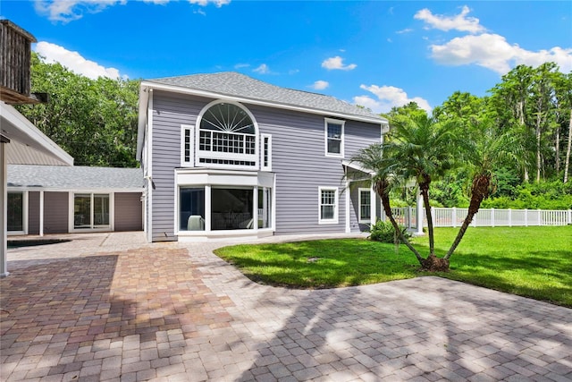3663 Berger Rd, Lutz, FL 33548 - back of property with a patio area and roof with shingles