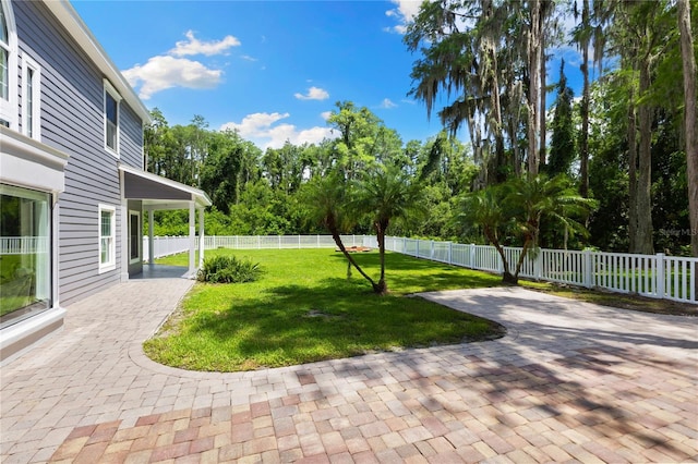 3663 Berger Rd, Lutz, FL 33548 - fenced backyard featuring a patio and view of scattered trees