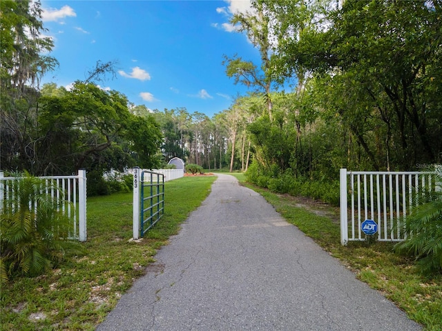 3663 Berger Rd, Lutz, FL 33548 - view of street featuring a gated entry
