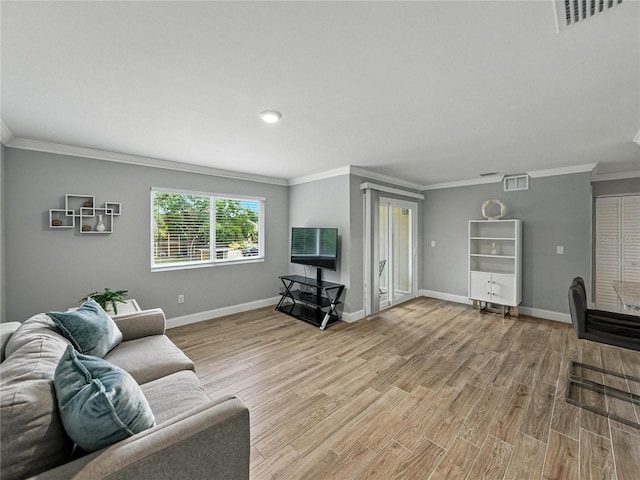 13285 Arbor Pointe Cir Unit 202, Tampa, FL 33617 - living area with crown molding and light wood-style flooring