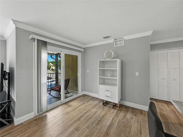 13285 Arbor Pointe Cir Unit 202, Tampa, FL 33617 - dining space featuring ornamental molding and wood finished floors