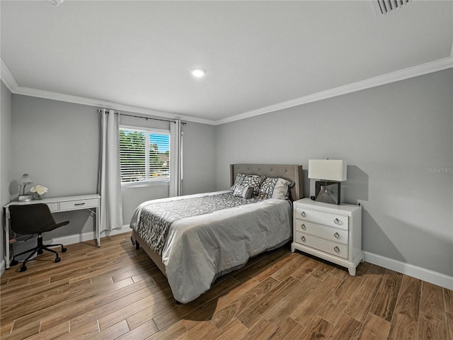 13285 Arbor Pointe Cir Unit 202, Tampa, FL 33617 - bedroom featuring ornamental molding, wood finished floors, recessed lighting, and an office area