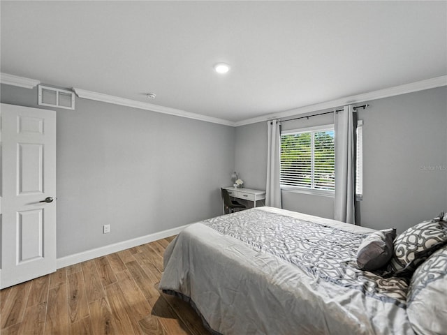 13285 Arbor Pointe Cir Unit 202, Tampa, FL 33617 - bedroom with wood finished floors, crown molding, and recessed lighting
