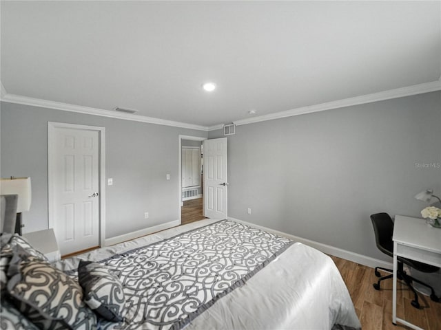 13285 Arbor Pointe Cir Unit 202, Tampa, FL 33617 - bedroom with crown molding, wood finished floors, a desk, and recessed lighting