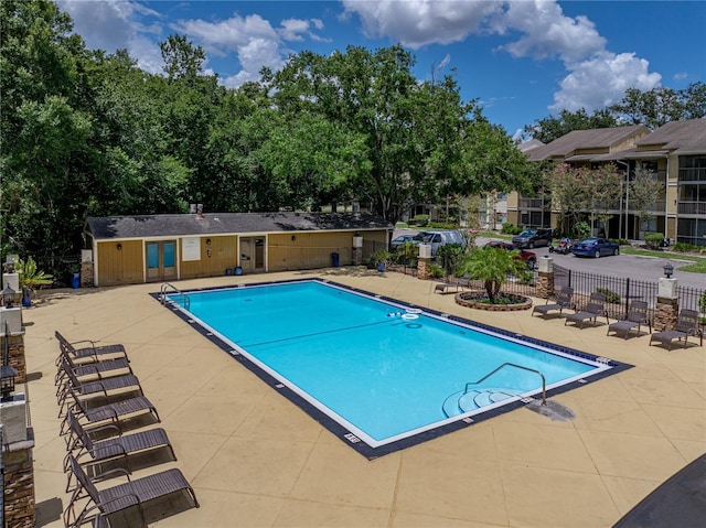 13285 Arbor Pointe Cir Unit 202, Tampa, FL 33617 - community pool featuring a patio