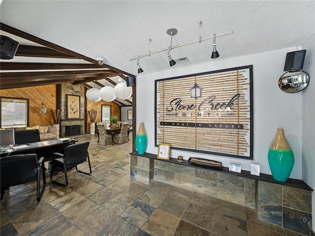13285 Arbor Pointe Cir Unit 202, Tampa, FL 33617 - reception area with wooden walls, beamed ceiling, a surveillance system, and a textured ceiling